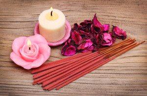 Spa Set. Burning candles with roses dried leaves and incense sti